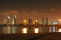 city at night across the bay 
