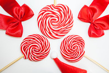 Flatlay of some red Christmas decoration, on a white background. Background for Christmas.