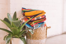 folded blankets in basket 