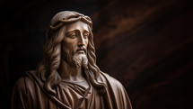 Statue of Jesus Christ on dark wooden background with copy space