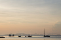 boats on the water at sunrise 