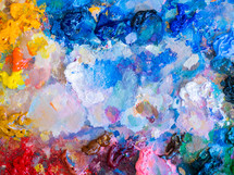 Artists multicolored oil paints on wooden palette or canvas. Close up abstract background. Art concept.