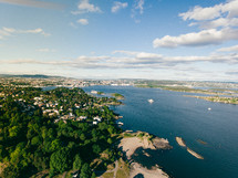 aerial view over a coastline and coastal town 