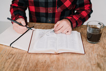 man underlining scripture 