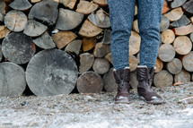 boots and stacked firewood 
