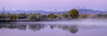Longs Peak Pano during the Fall Season as the mountains and trees reflect in the pond