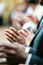 hands at a worship service 