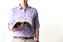 man reading a Bible
