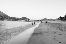 People walking on the beach in Cabo San Lucas.