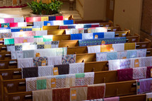 quilts on church pews 