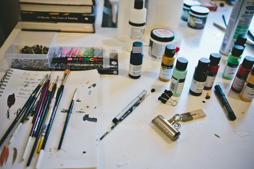 paint and paint brushes and art supplies 