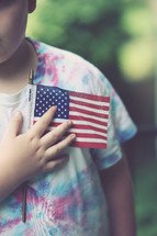 toddler boy holding an American flag