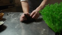 Hands Of Chef Mixing The Dough For Black Squid Ink Spaghetti Pasta Food