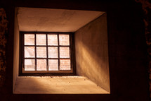 sunlight shinning into a cellar window 