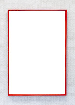 Empty painting with red frame on gray and modern wall. Vertical orientation.