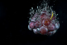 grapes in water with air bubbles