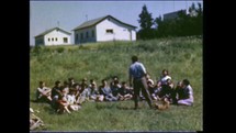 Menashe Heights, Israel, Circa 1940's. Color footage of people playing in a swimming pool in a kibbutz