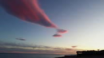 Strange color clouds over a coastline in Italy 