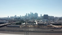 Financial skyscrapers. Business district with skyscrapers. Rising drone shot from residential buildings. Aerial view of cityscape. Urban aerial view of beautiful and scenic downtown Los Angeles. 