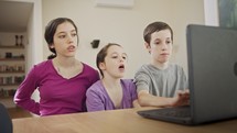 Mother talking to her kids online on the computer during the COVID-19 lockdown