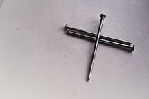 three nails on a white background 