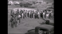 ISRAEL, July 1937. Jewish pioneers establishing a new kibbutz in northren Israel as part of the Tower and Stockade era.