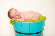 naked newborn in a barrel 