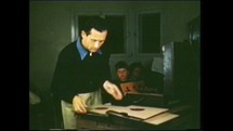 Menashe Heights, Israel, Circa 1940's. Color footage of office workers handling papers