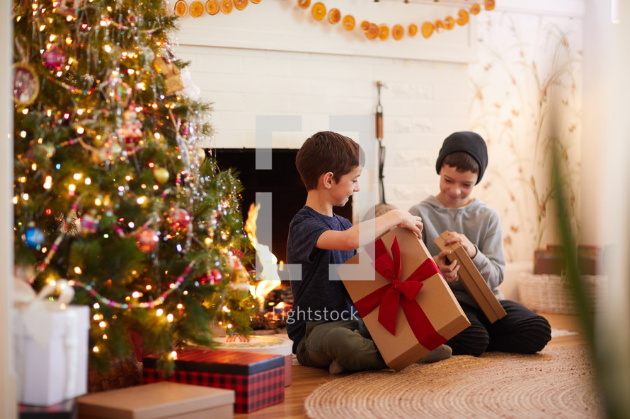 brothers opening Christmas gifts together