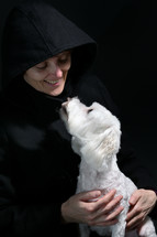 Smiling Woman, With White Maltese Dog on black background