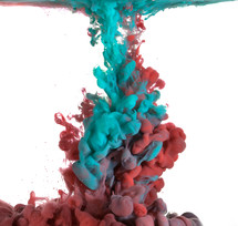 teal and red paint in water 
