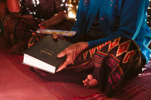 sharing a Bible during a worship service 