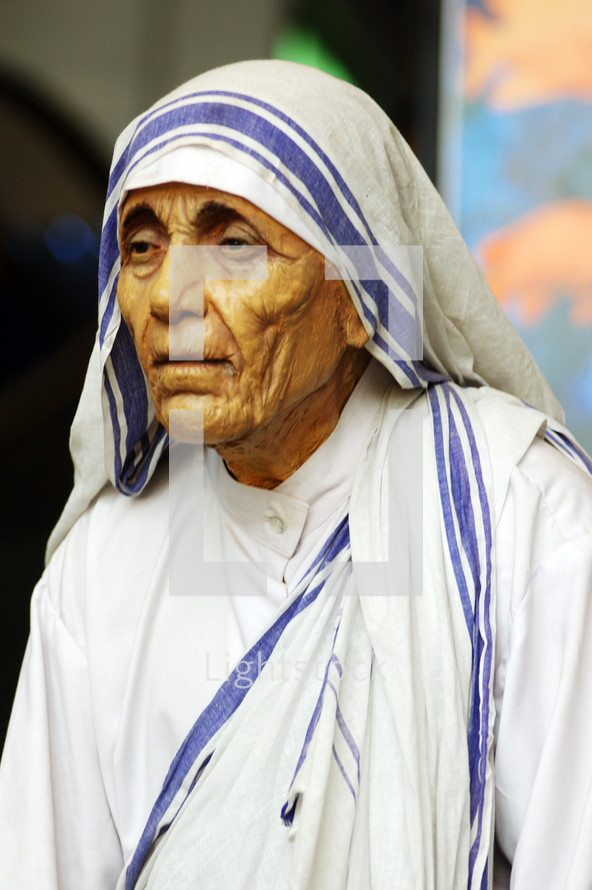 elderly woman in a head scarf in India 