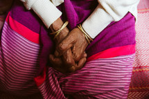 elderly woman with praying hands 
