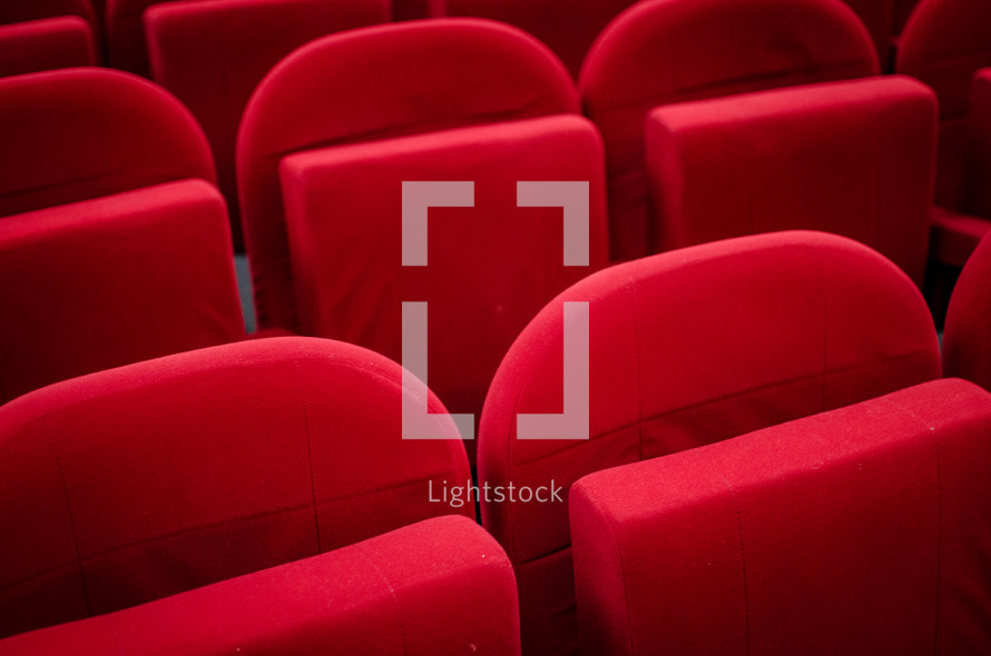 plush red seats in a cinema auditorium