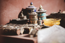 brass jars at a temple in Tibet