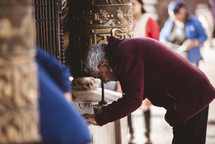 people praying at a temple in Tibet 