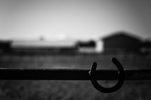horseshoe on a fence at a ranch 