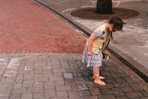 a little girl in a puddle 