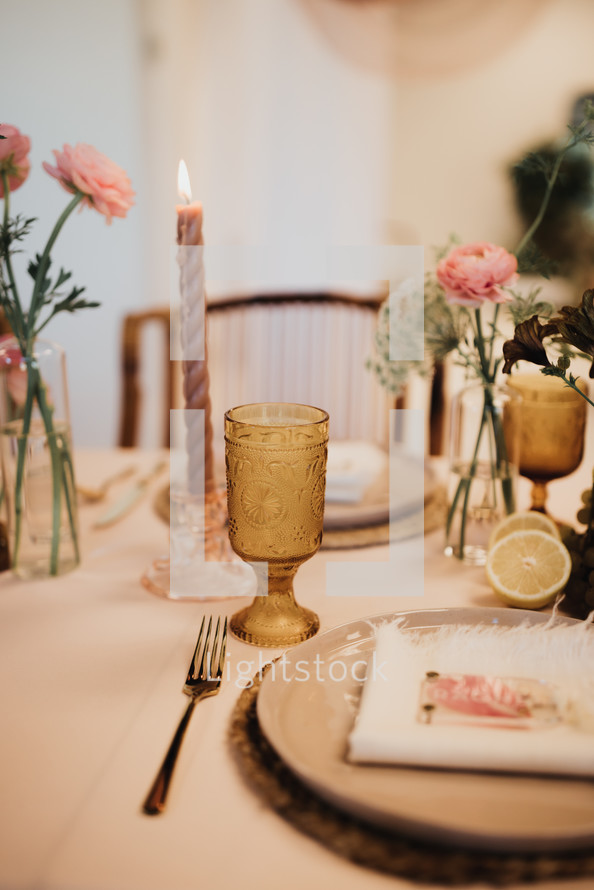 set table with candlesticks and flowers 