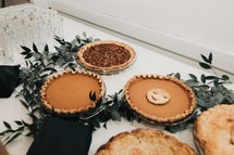 pies on a dessert table 