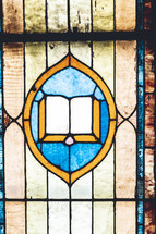 stained glass window of the Bible 