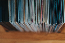 row of vintage records on a shelf 