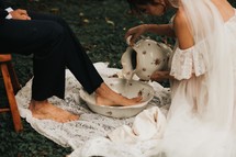 foot washing during a wedding ceremony 
