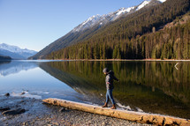 a person standing on a lake shore in Canada 