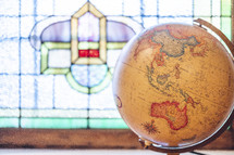 stained glass window and globe 
