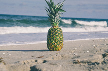 pineapple on a beach 