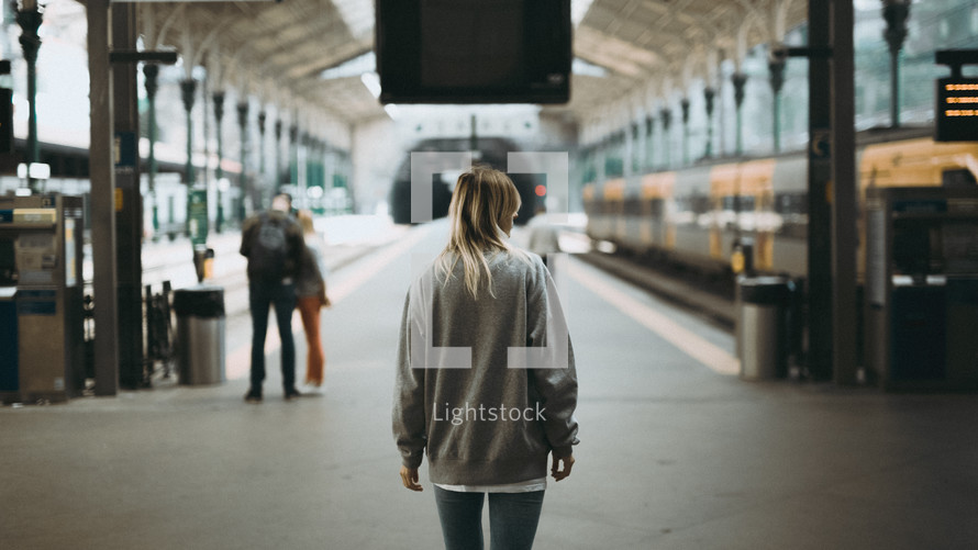 a woman at a train station 
