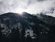 sunburst behind a mountaintop 