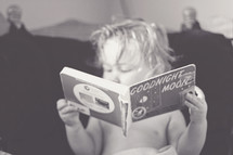 toddler reading Goodnight moon book 